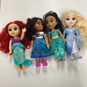 Disney Princess dolls, from various Disney movies. Ariel, Mirabel, Moana, & Elsa